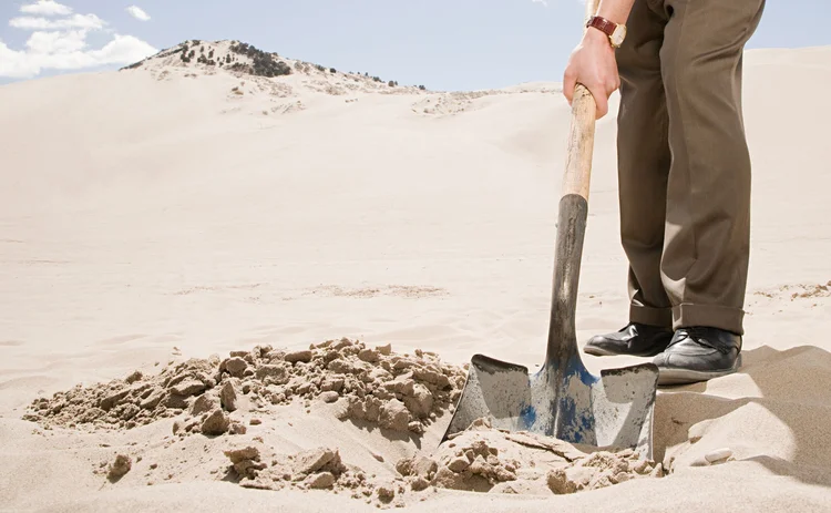 Digging a hole in the sand