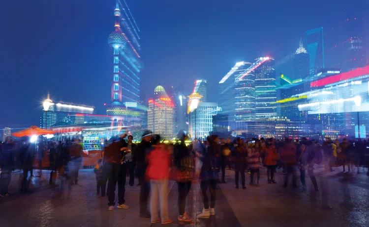 shu-334145906-china-blur-night-skyscrapers-crowd